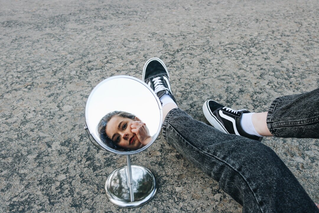 person smiling confidently in mirror