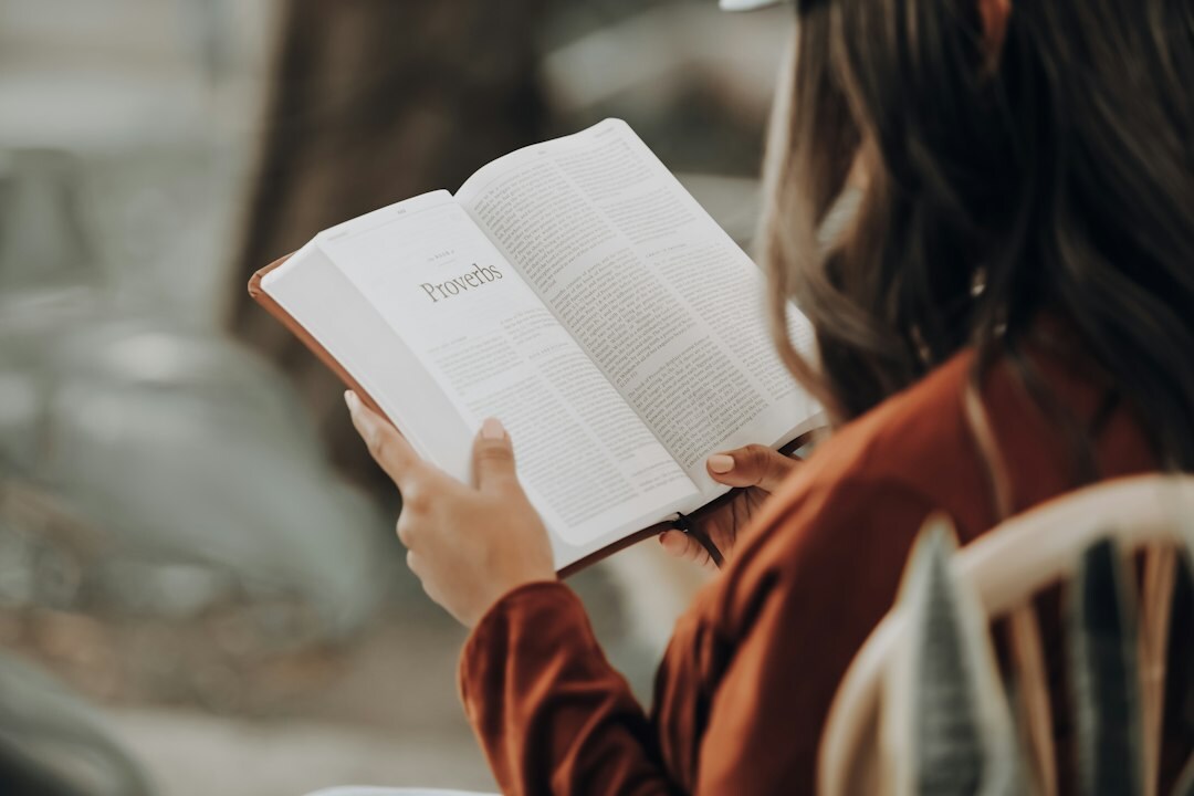 person reading self help book